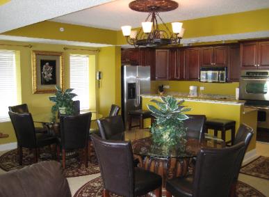 Myrtle Beach House Rentals - Two 54 inch Round Glass Dining Tables and Kitchen Bar Counter provides plenty of Dining space for the Guests of www.JeffsCondos.com - Ocean Blue Myrtle Beach 