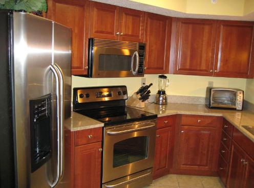 The Luxury Kitchen by www.JeffsCondos.com at Dunes Village in Myrtle Beach is appointed with granite counter tops, red cherry cabinets, UPGRADED stainless steel appliances(only unit in the building)