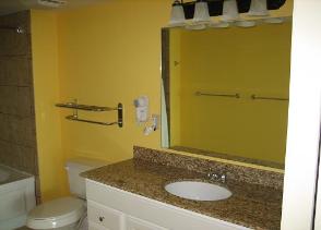 Master bedroom bathroom with granite counter tops and custom tile shower